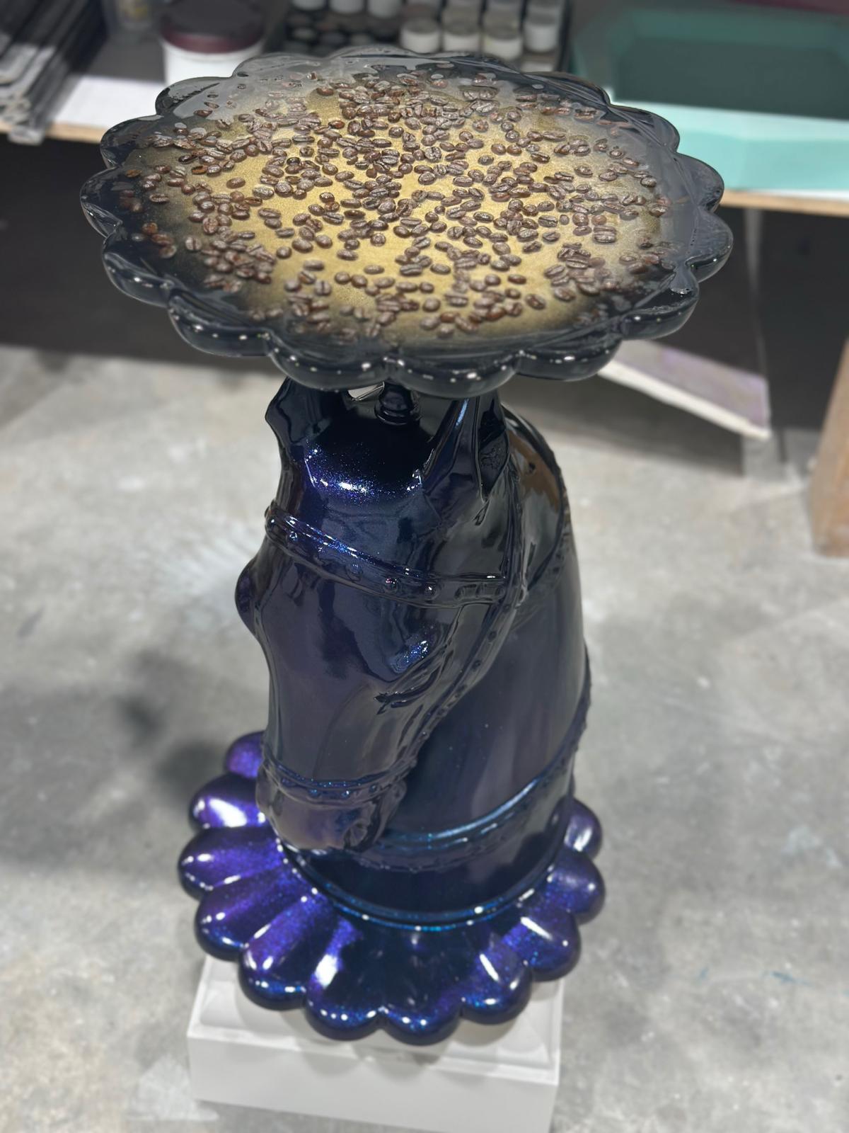 Iridescent blue coffee table styled with coffee beans