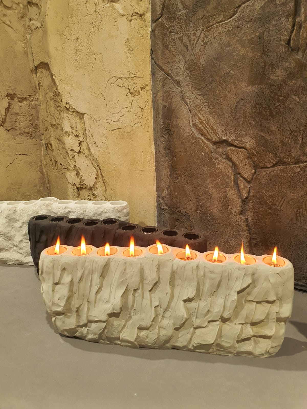 Decorative concrete wall with sculptural menorah